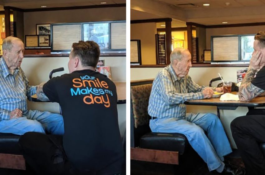  A young waiter knelt down in front of an old man in a cafe so that the old veteran could hear what he was saying to him